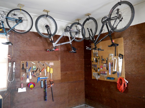 Hooks and plywood make storing bikes easy.