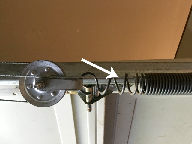 Safety cable in a garage door spring