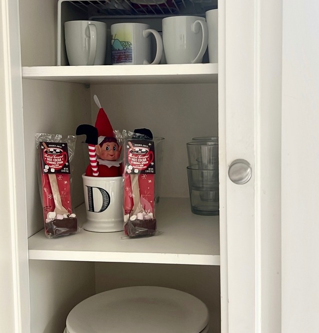 Hide the elf in a kitchen cabinet